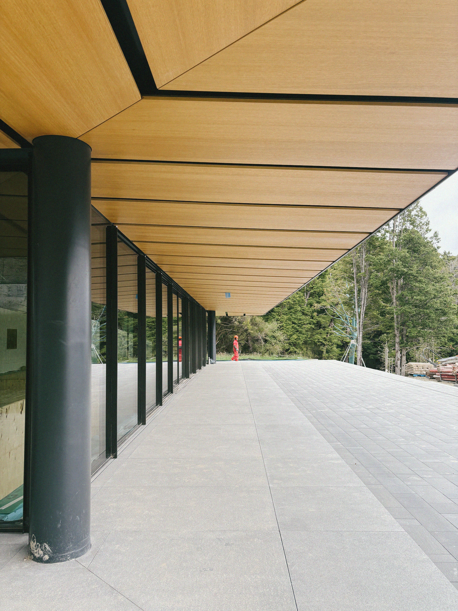 Timber and stone corridor with glass roof