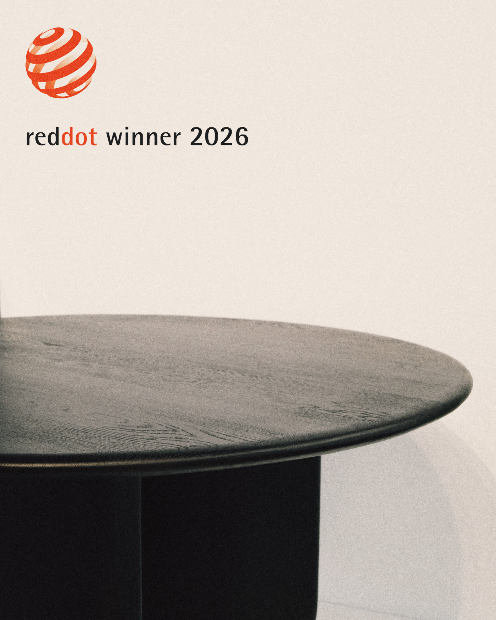 Maru Table in solid charcoal oak, Red Dot winner 2026