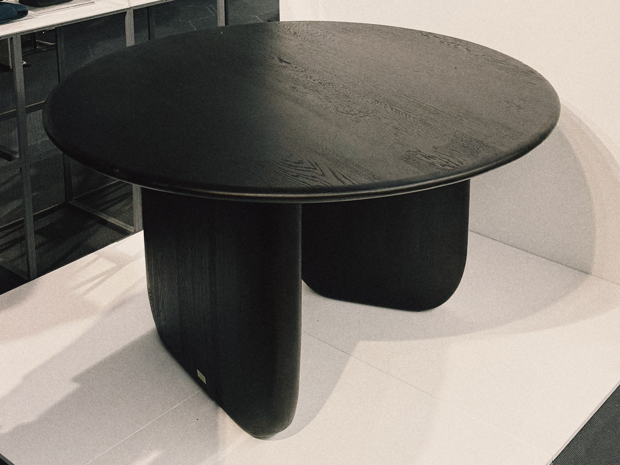 ENWA Maru Table in charcoal oak on display at the Red Dot Award: Design Concept 2026 Winners' Exhibition, Red Dot Design Museum Singapore
