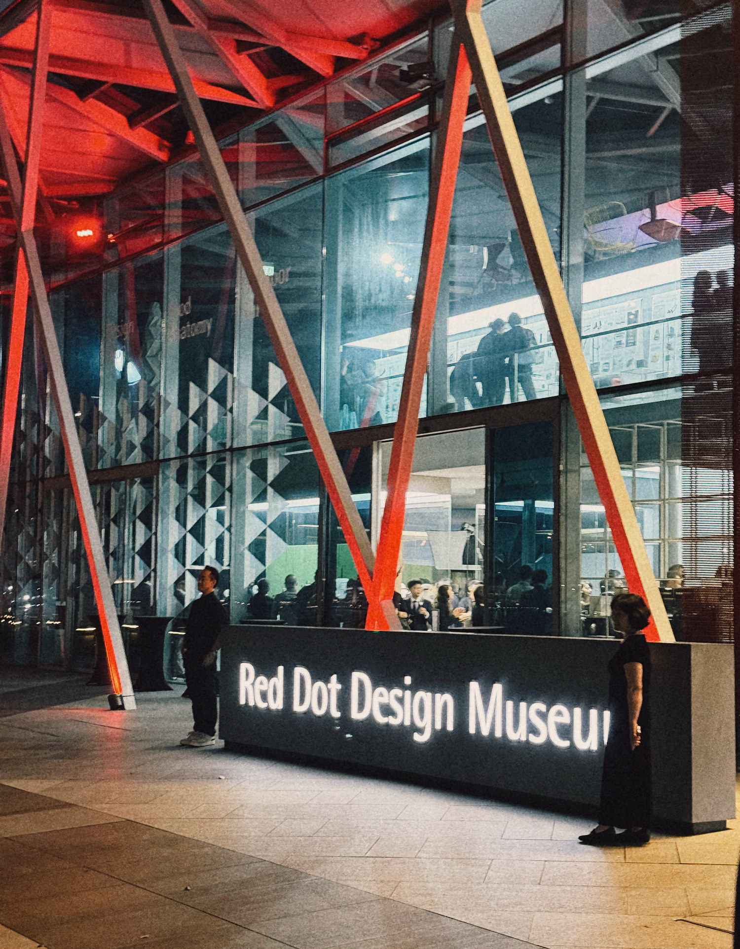 Red Dot Design Museum Singapore at Marina Bay at night during Designers' Night, October 2026