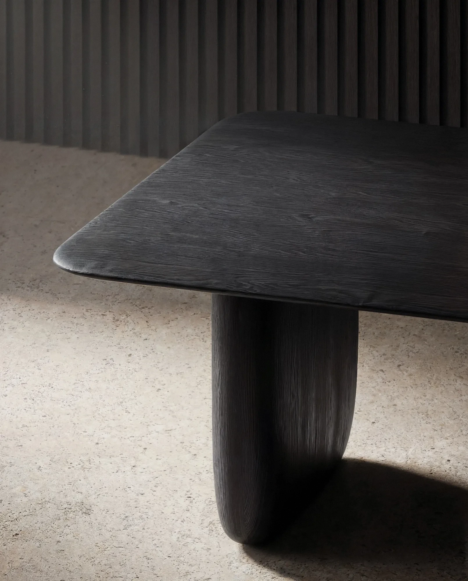 Sen Dining Table — edge and pedestal detail