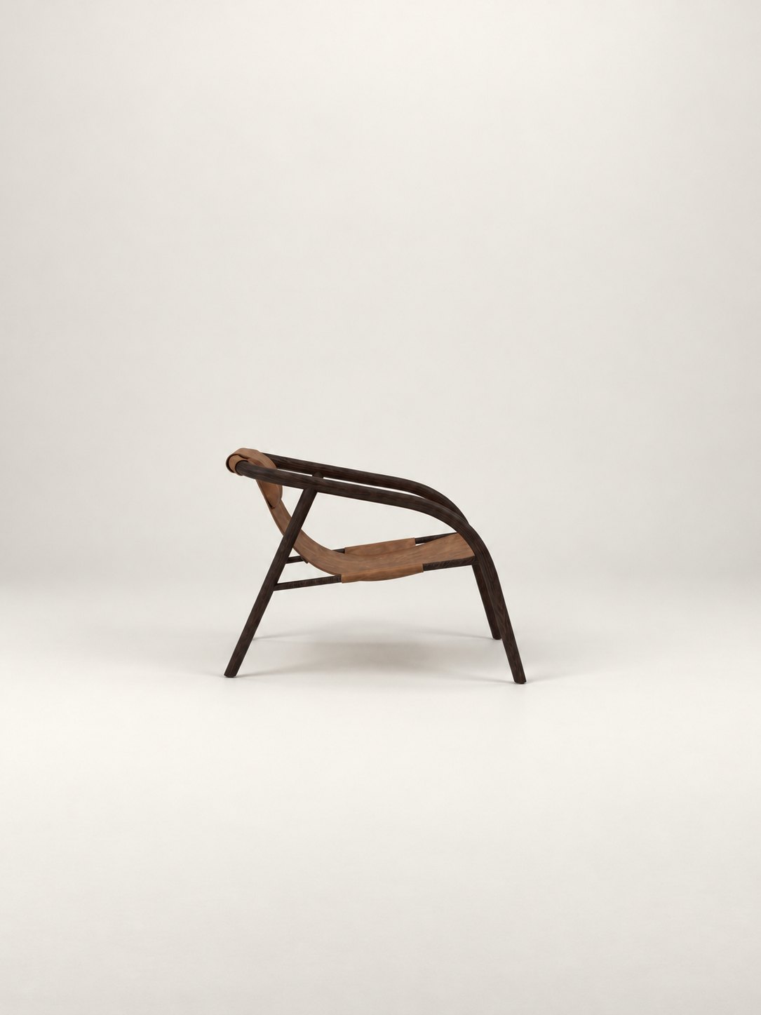 ENWA lounge chair in profile on a studio backdrop
