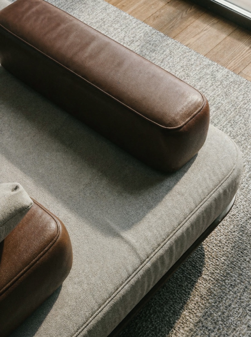 Sora sofa upholstery detail — woven fabric and leather