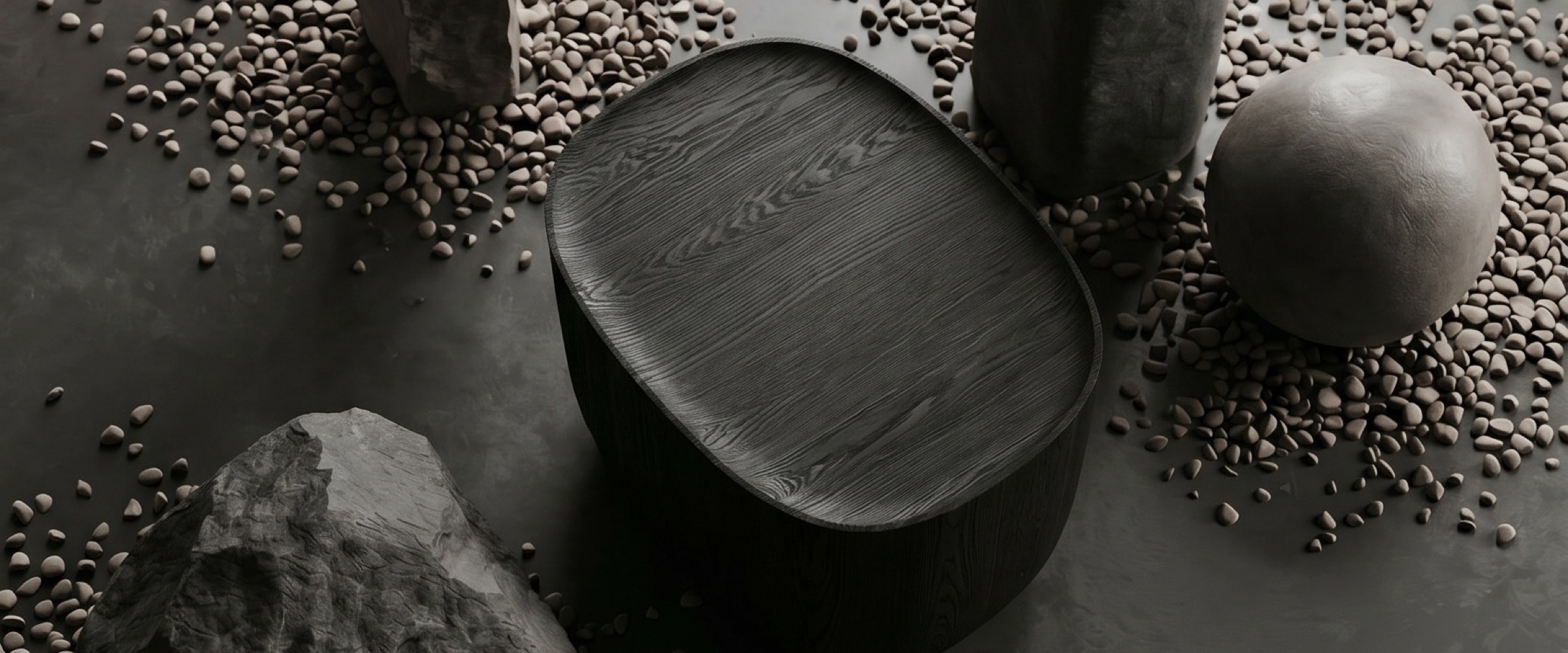 Ishi Stool in a quiet still-life between stone and concrete