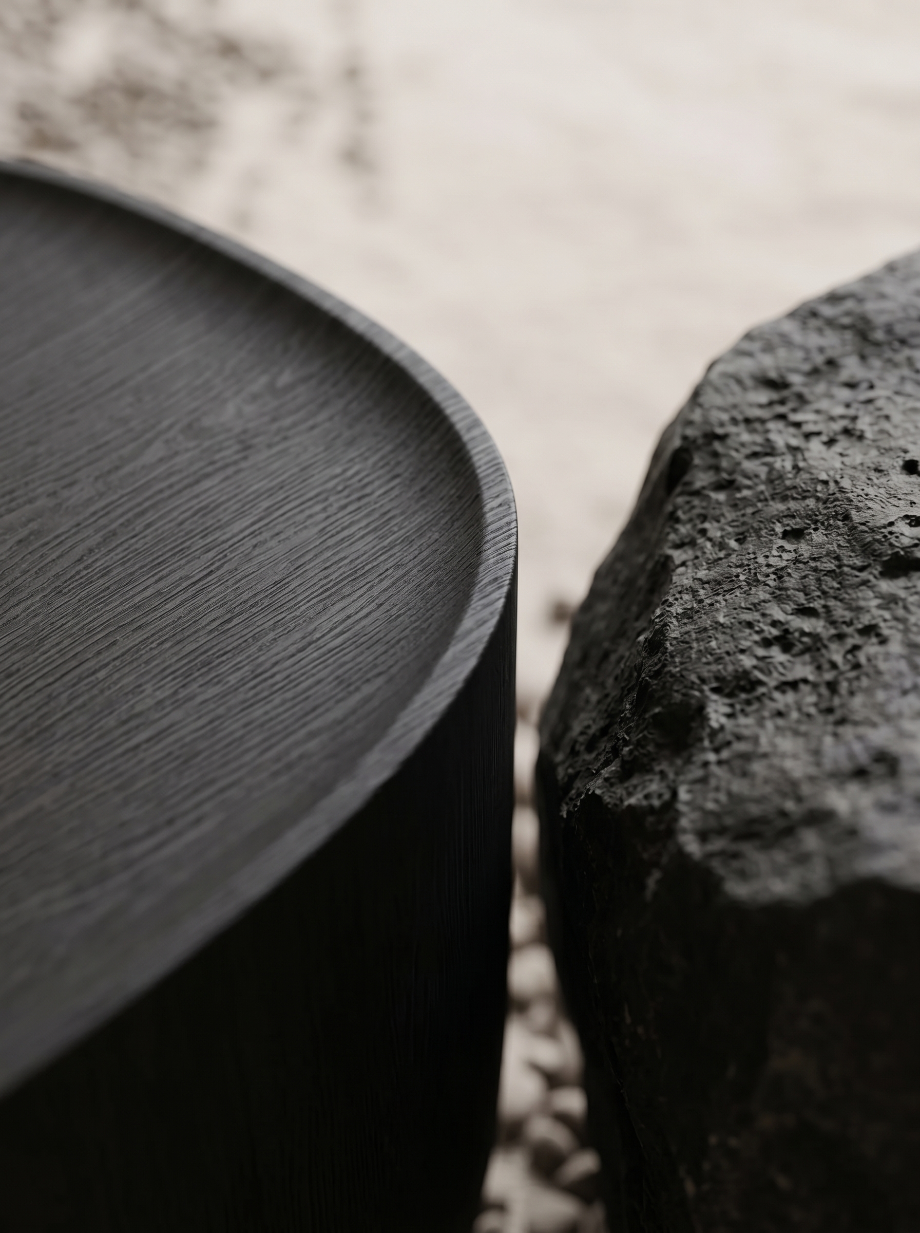 Ishi Stool — oak grain beside volcanic stone