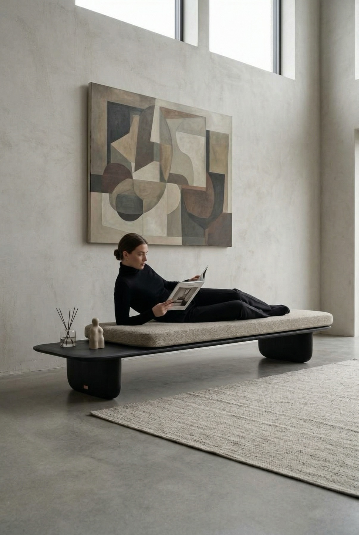 Kawa Bench in a gallery-like living space with a seated reader