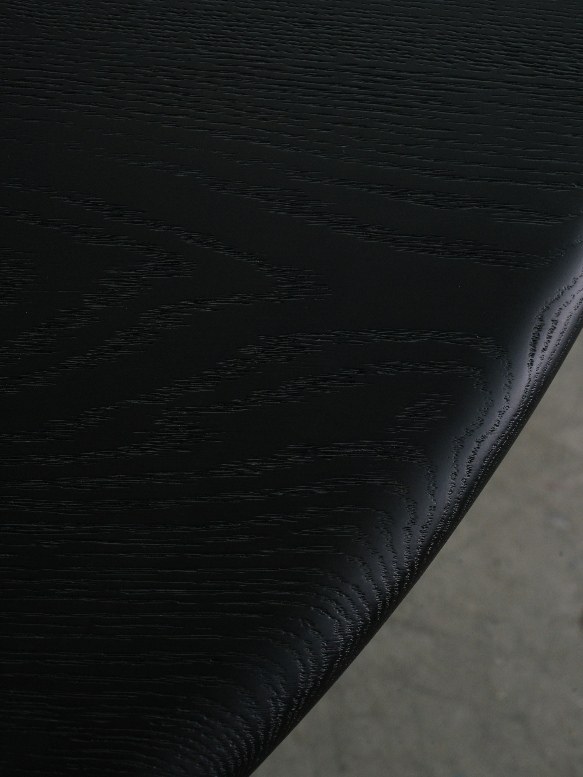 Charcoal oak grain, read as texture