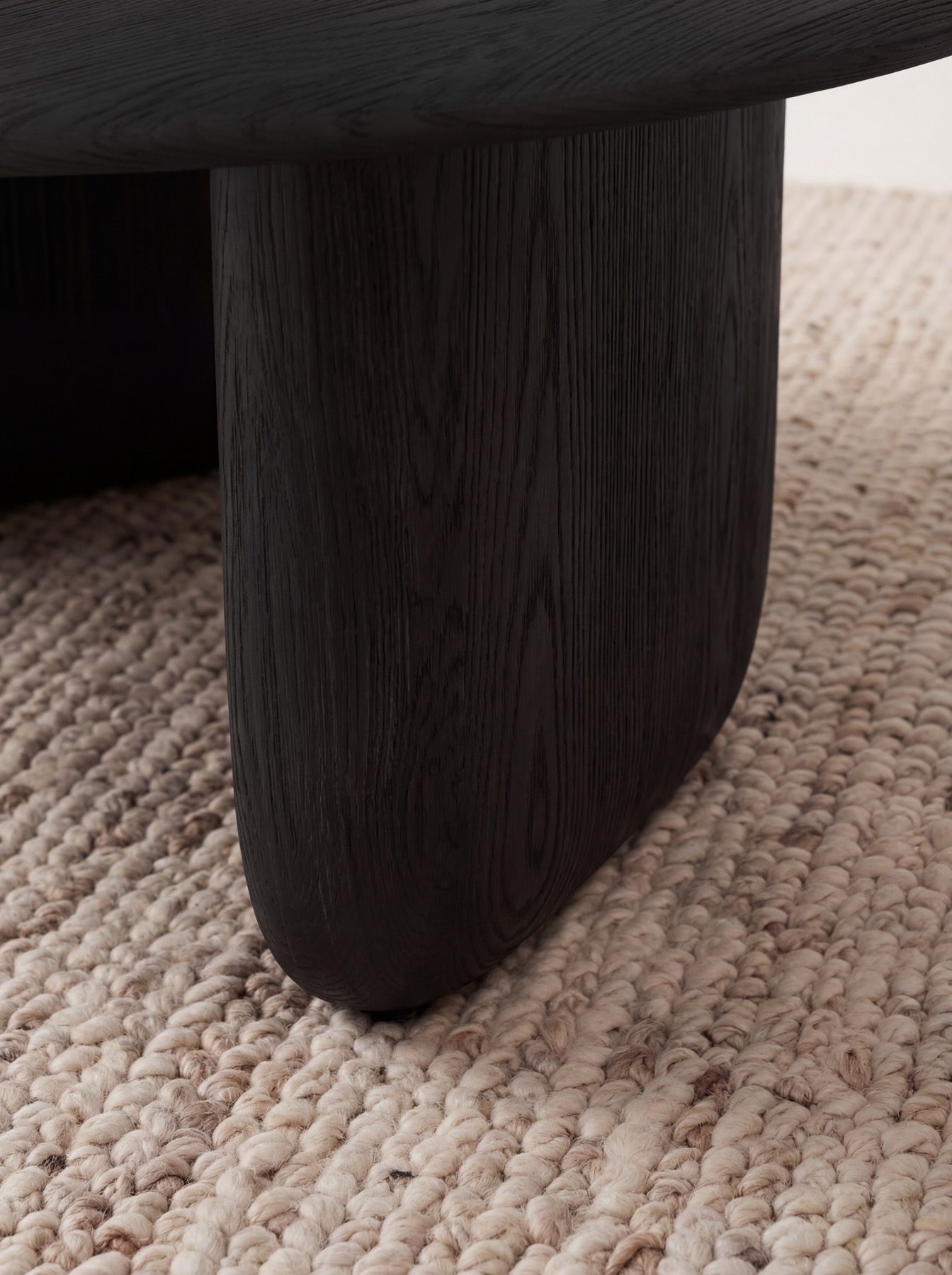Tsuki Coffee Table leg detail — dark oak grain